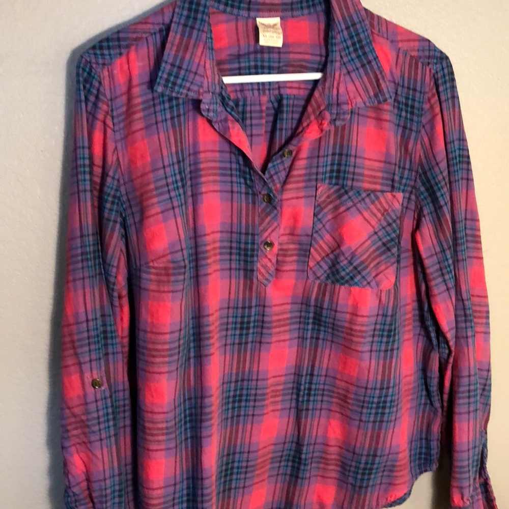Red and blue plaid pull over plaid shirt
